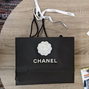 Chanel paper bag, ribbon and camellia flower